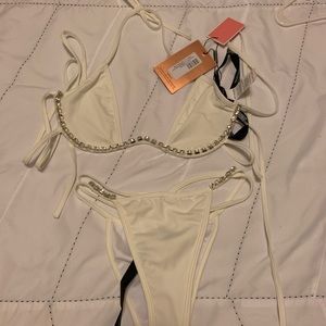 Pretty little thing white jeweled swim suit.